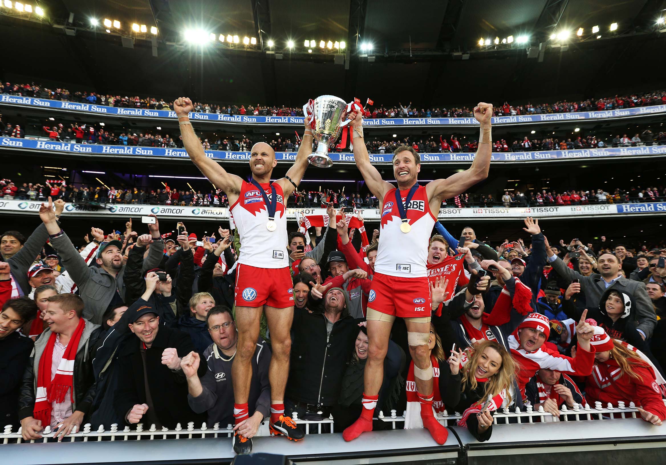   AFL Grand Final - Sydney Swans v Hawthorn at the MCG. Jarrad McVeigh and Jude Bolton of the Swans celebrate with the cup  