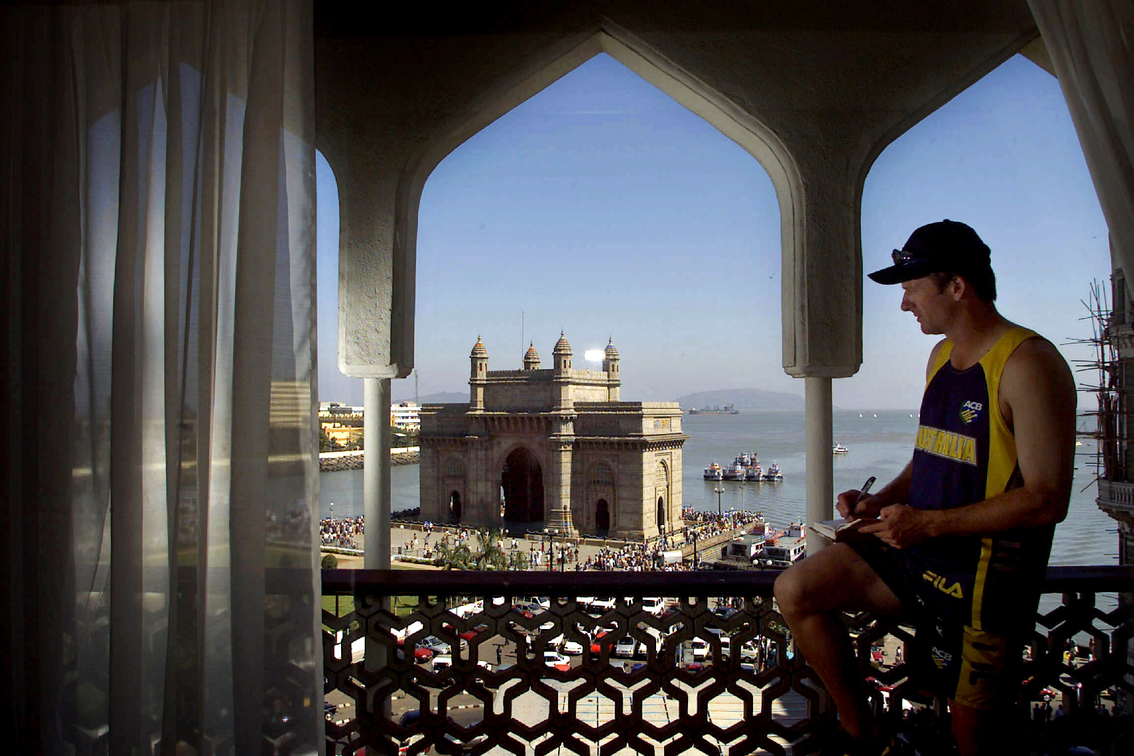   Aust cricketer Steve Waugh admiring the view from his room in the Taj Mahal Hotel in Bombay, India during cricket tour 26 Feb 2001.  
