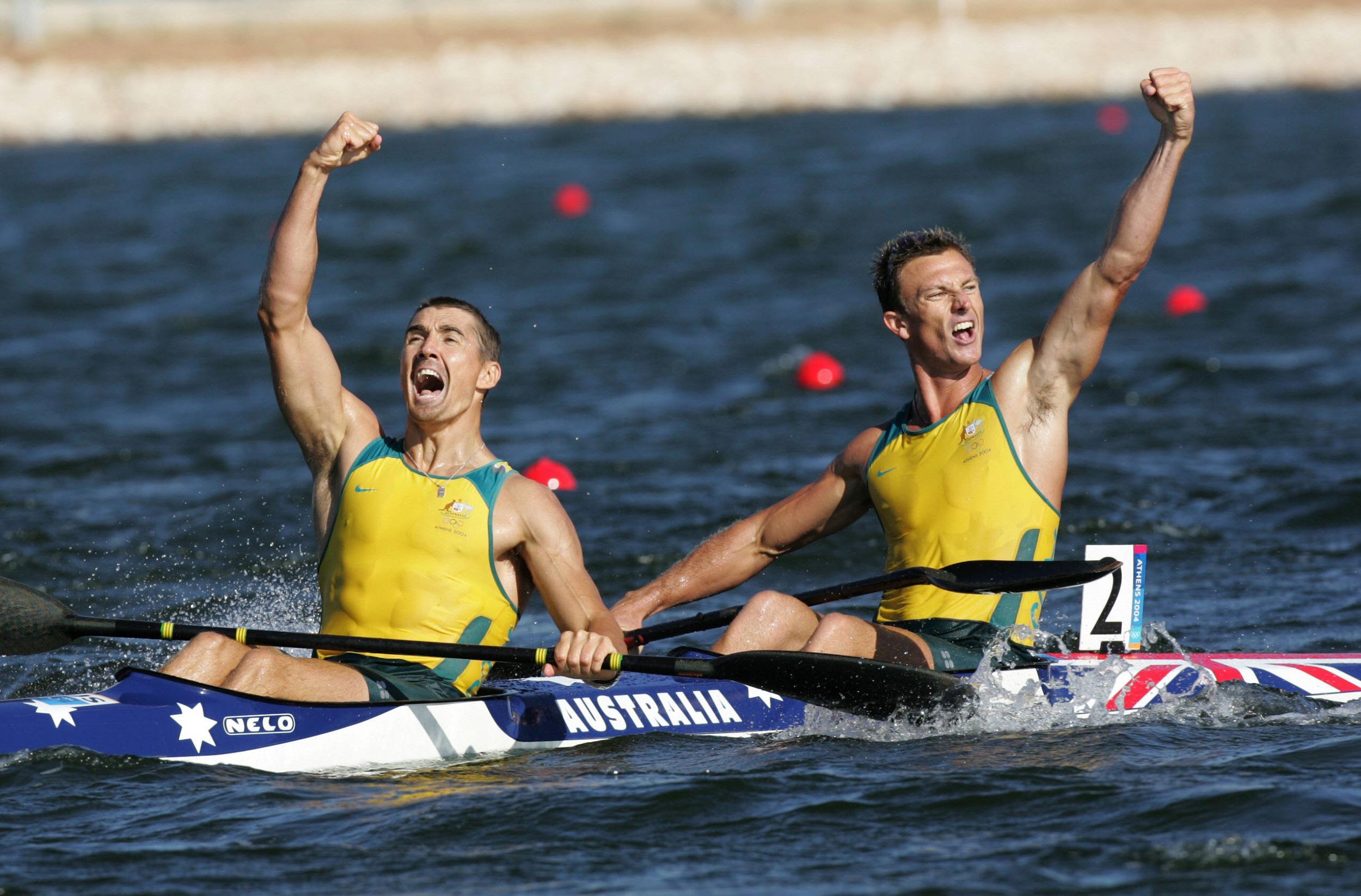   28/08/2004: Clint Robinson and Nathan Baggaley of Australia celebrate crossing the line for the silver medal.   Athens Olympics 2004 Day15. Canoe Flatwater. K2 500.  