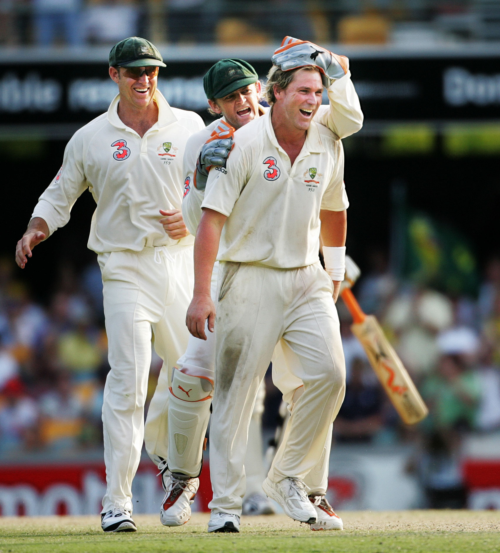  Wicketkeeper Adam Gilchrist congratulates bowler Shane Warne after wicket during first test of Australia v England Ashes series at the Gabba in Brisbane.  